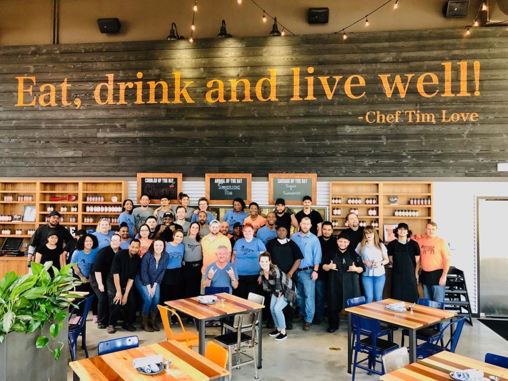 Chef Tim Love surrounded by staff in Houston