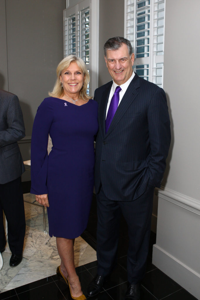 Paige Flink wearing Elie Tahari with Mike Rawlings. 