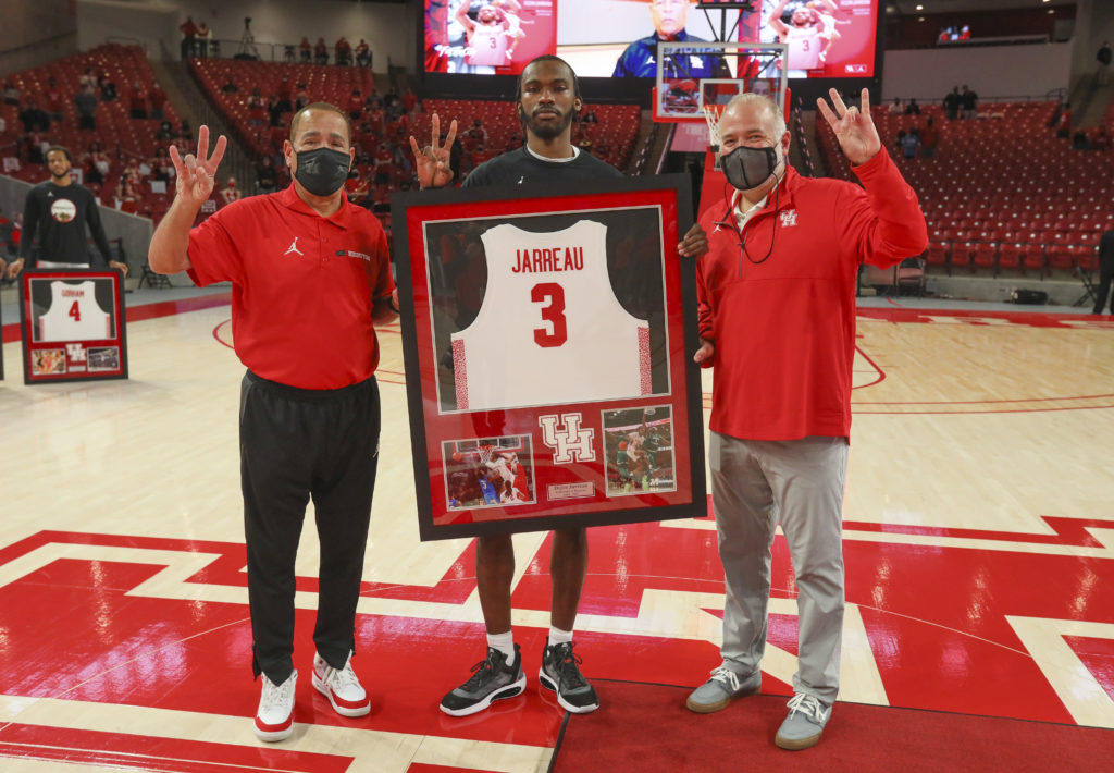 Kelvin Sampson, DeJon Jarreau and UH athletic director Chris Pezman share a moment on Senior Day last March. (Photo by Houston Athletics/Stephen Pinchback)