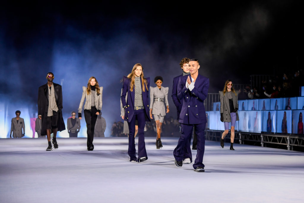 Balmain creative director Olivier Rousteing leads models down the runway at the end of his audience-less runway show. (Photo courtesy of Balmain)