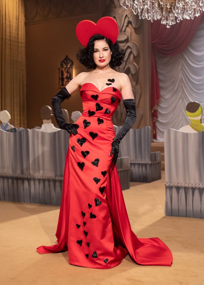 Dita von Teese models a Moschino red gown with black hearts. (Photo courtesy of Moschino)