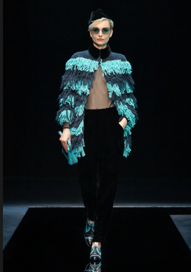 Giorgio teal and blue fringe sweater and black trousers. (Photo courtesy of Giorgio Armani)