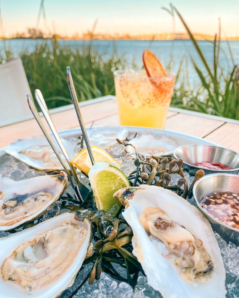Enjoy oysters and cocktails by the water at Amara at Paraiso. (Courtesy)