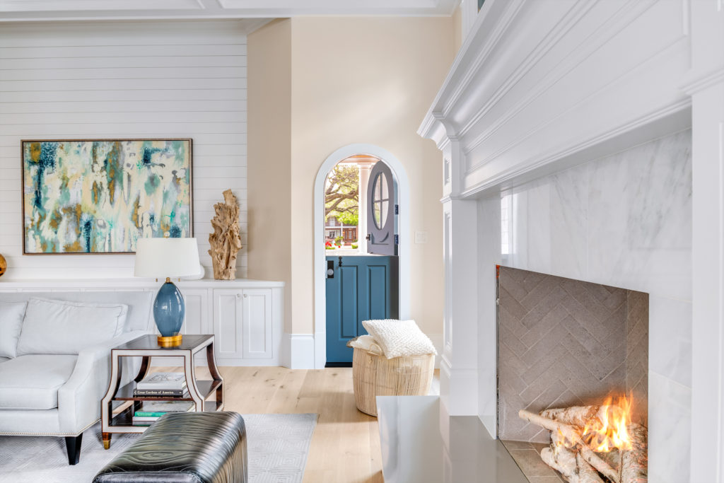 A charming Dutch door by the marble-lined fireplace. (Photo courtesy of Compass Real Estate)