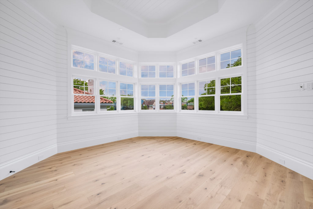 A spacious upstairs bedroom with a killer view. (Photo courtesy of Compass Real Estate) 