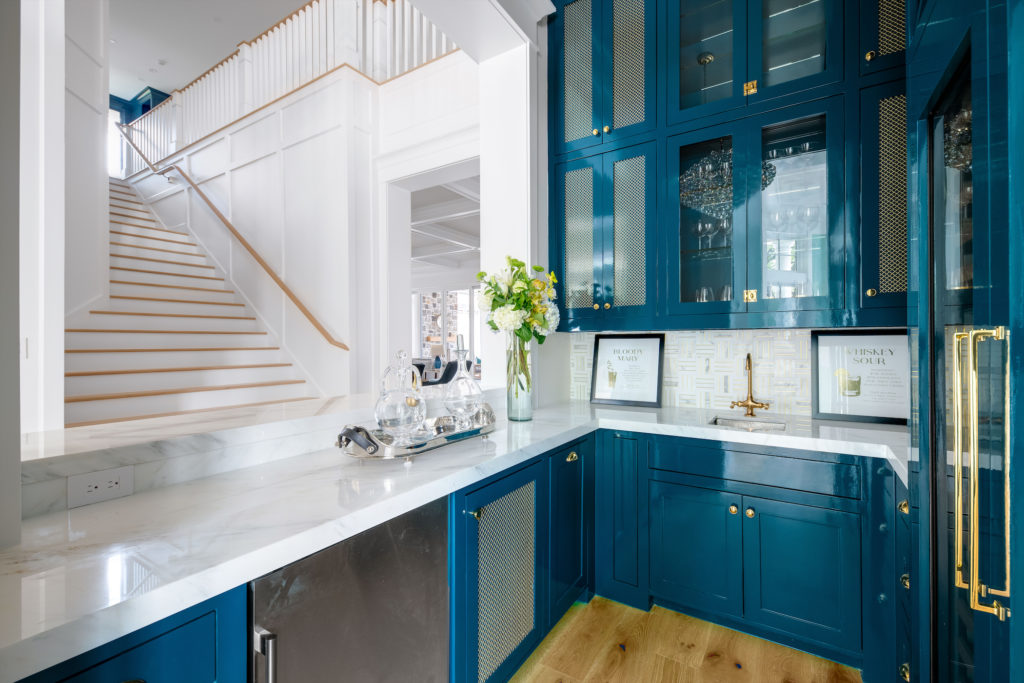 Walking down the stairwell and straight to the bar... the dream. (Photo courtesy of Compass Real Estate)