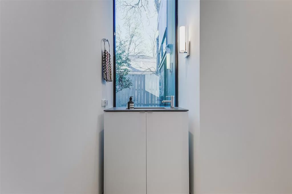 The East Village home includes two full bathrooms and one half bath. 