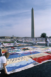 An example of how artisans use their talent to join communities for a cause. AIDS Memorial Quilt on the National Mall lawn; 20,000 quilts are displayed. The Washington Monument can be seen in the background. (Photo by Jeffrey Markowitz/Sygma via Getty Images)