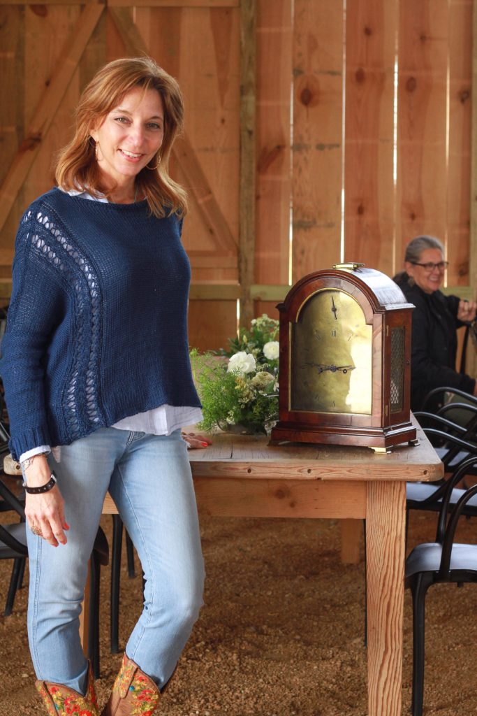 Ana Gore with 18th-century British clock.jpg (Photo by Chris P. Bachman )