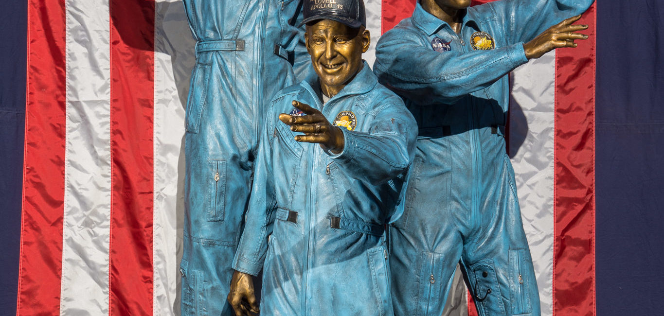 Life-size bronze sculptures of astronauts James Lovell, Fred Haise, and the late Jack Swigert of the Apollo 13 mission at NASA Johnson Space Center. (Photo by Warwick Adventures)