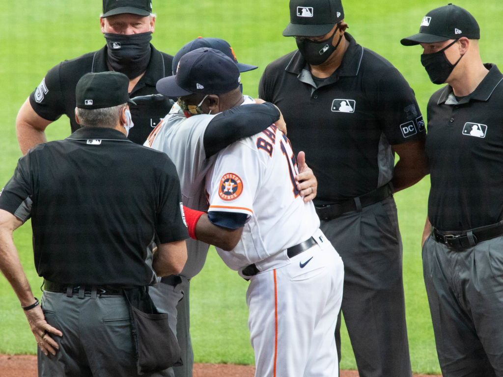 A.J. Hinch and Dusty Baker and exchanged hugs along with lineup cards. (Photo by F. Carter Smith)