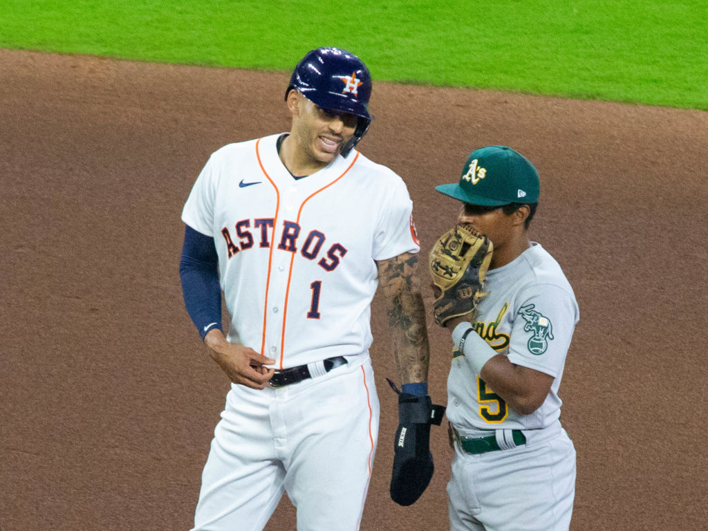 Carlos Correa and Tony Kemp caught up at second base. (Photo by F. Carter Smith)