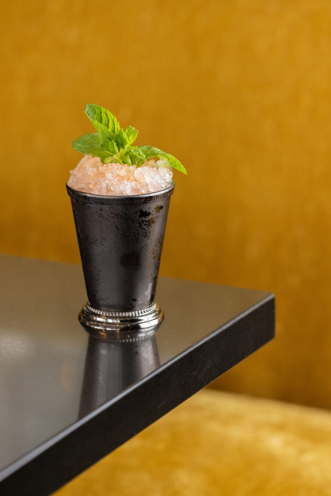 Âme's East India Swizzle comes with rum, banana liqueur, East India Sherry, and cane sugar. (Photo by Kathy Tran)