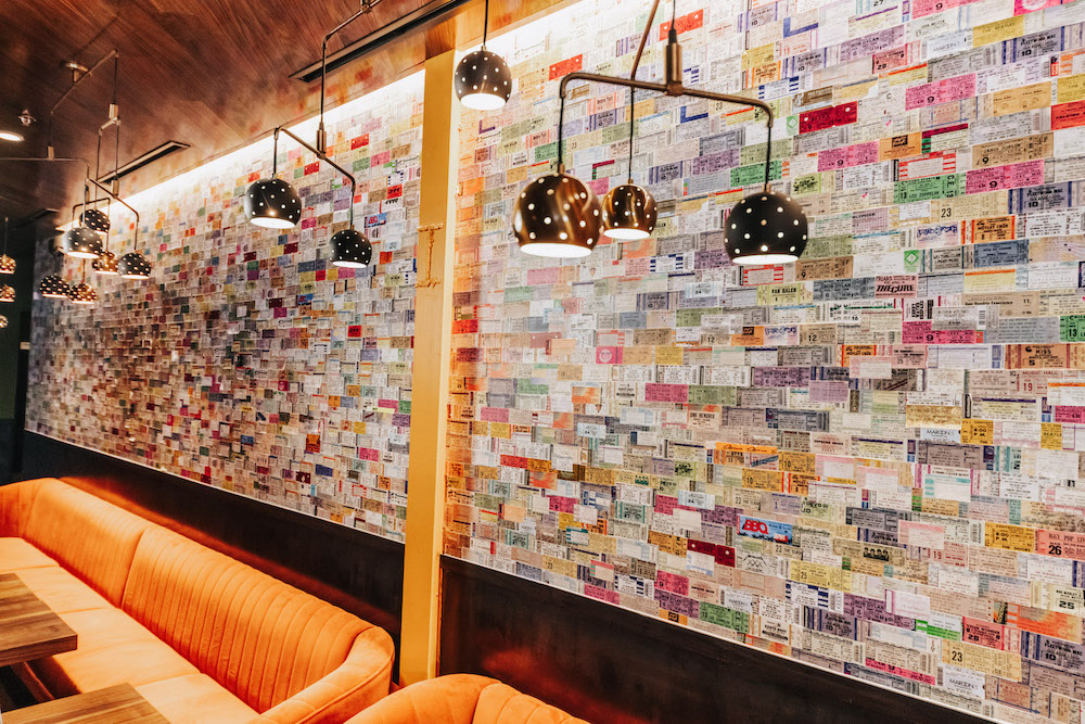 Postino Dallas' unique touch will be a vintage concert ticket-covered wall.  (Photo by Kathy Tran )
