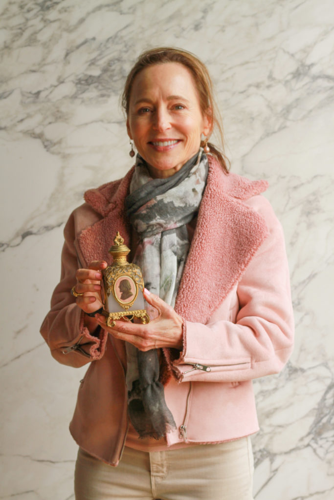  Hollis Hibbert poses with her French 19th-century perfume bottle. (Photo by Chris P. Bachman)