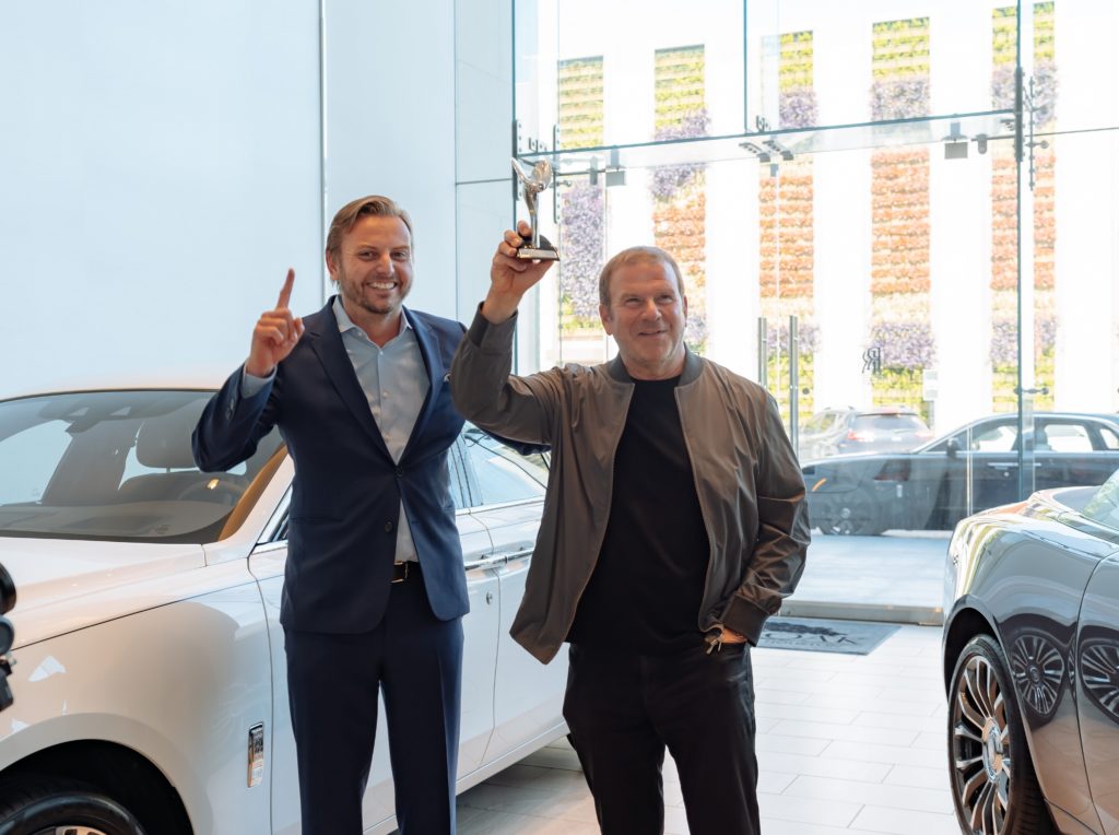 President and CEO of Rolls-Royce Motor Americas Martin Fritsches and Tilman Fertitta, CEO of Fertitta Entertainment and owner of Post Oak Motor Cars, celebrate the dealership's big win. (Photo by Bread and Water Productions)