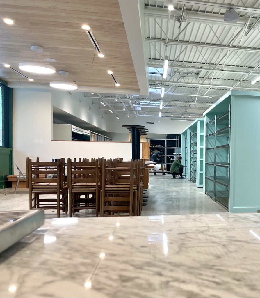 Roy Pope's empty shelves will soon be fully stocked with gourmet goodies. (Photo by Courtney Dabney).