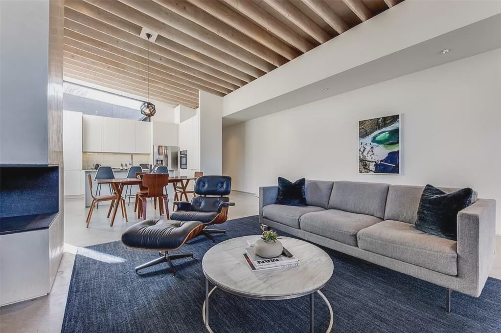 Glazed concrete floors, custom shades, and museum walls can be found throughout 2217 Annex Avenue. 