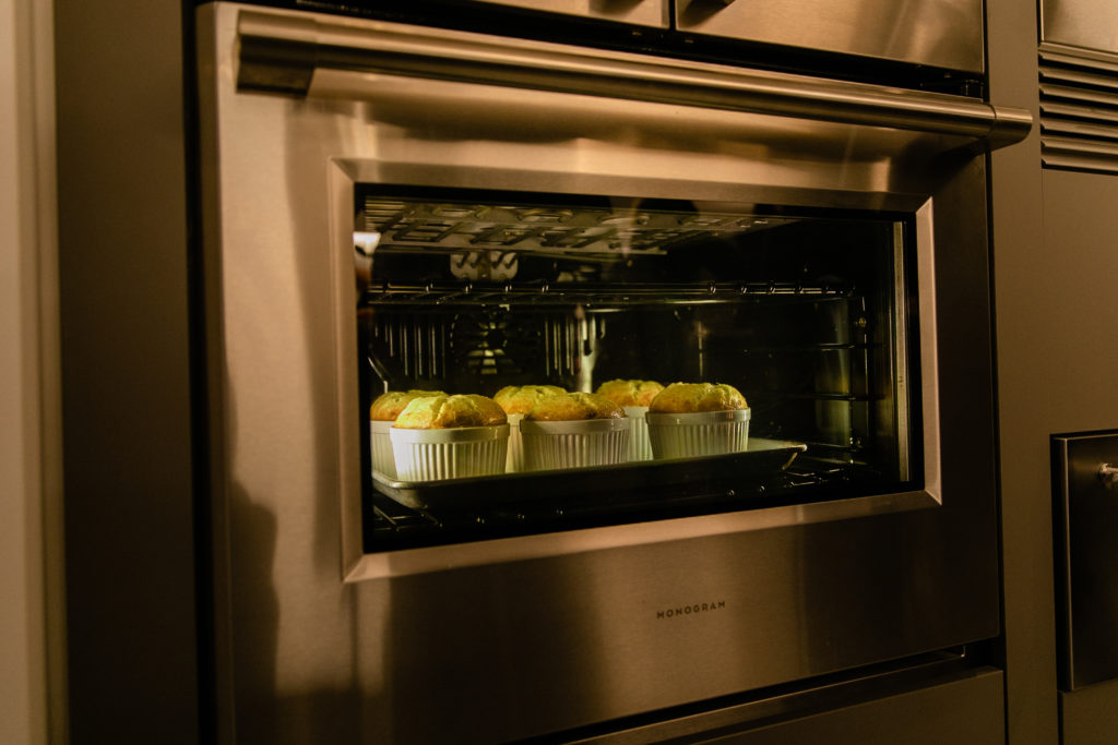 Fab Fête soufflés baking in the Monogram oven for the Texas Design Week event at COOKCHILL (Photo by Johnny Than)