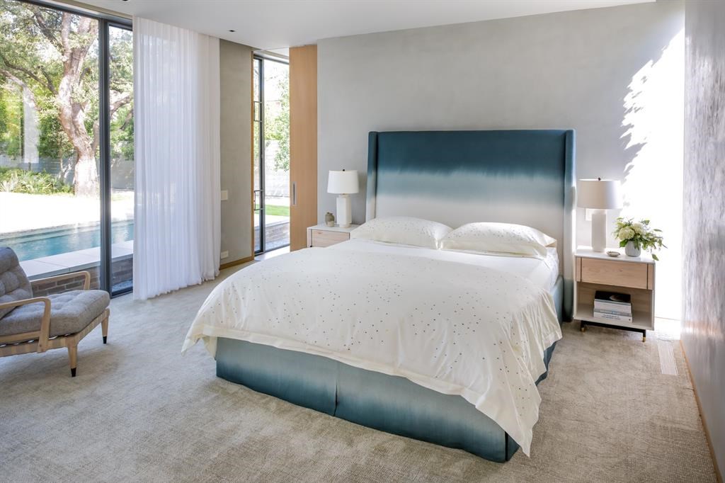 Striking views of the courtyard, pool, and garden can be found throughout the home. 