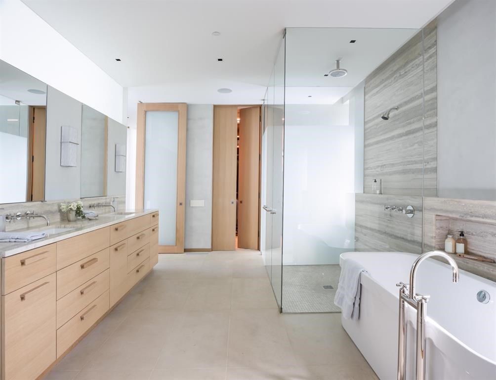 A clean-lined, spa-like master bathroom. 