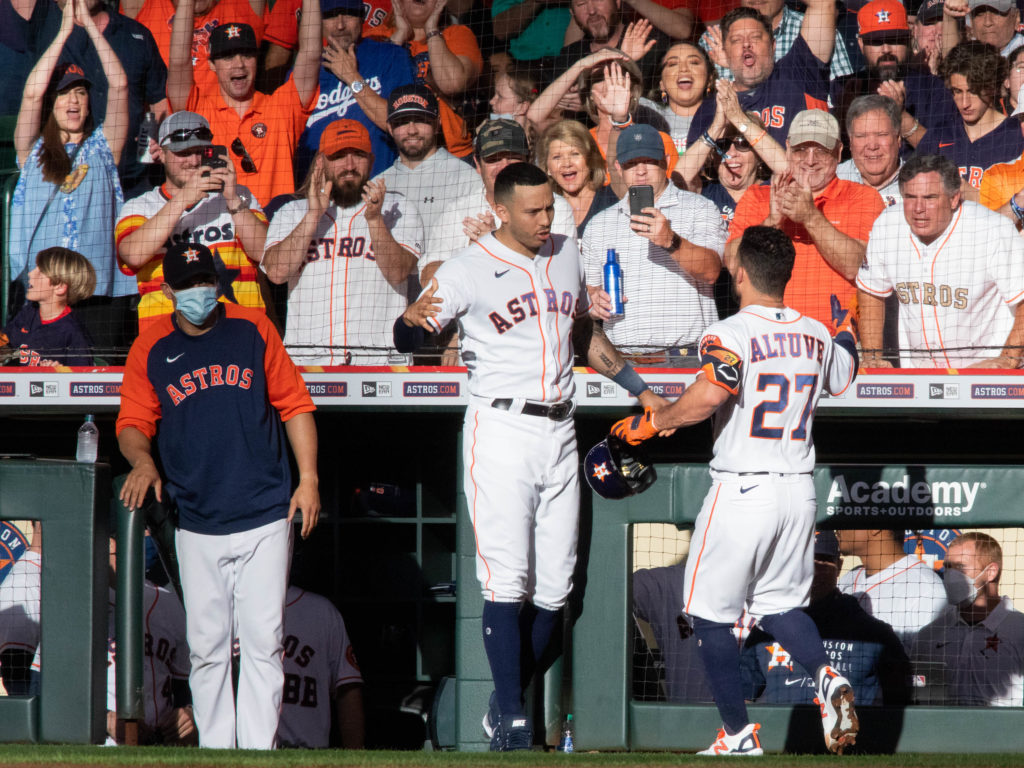 Jose Altuve and Carlos Correa are used to celebrating big Astros moments. (Photo by F. Carter Smith)