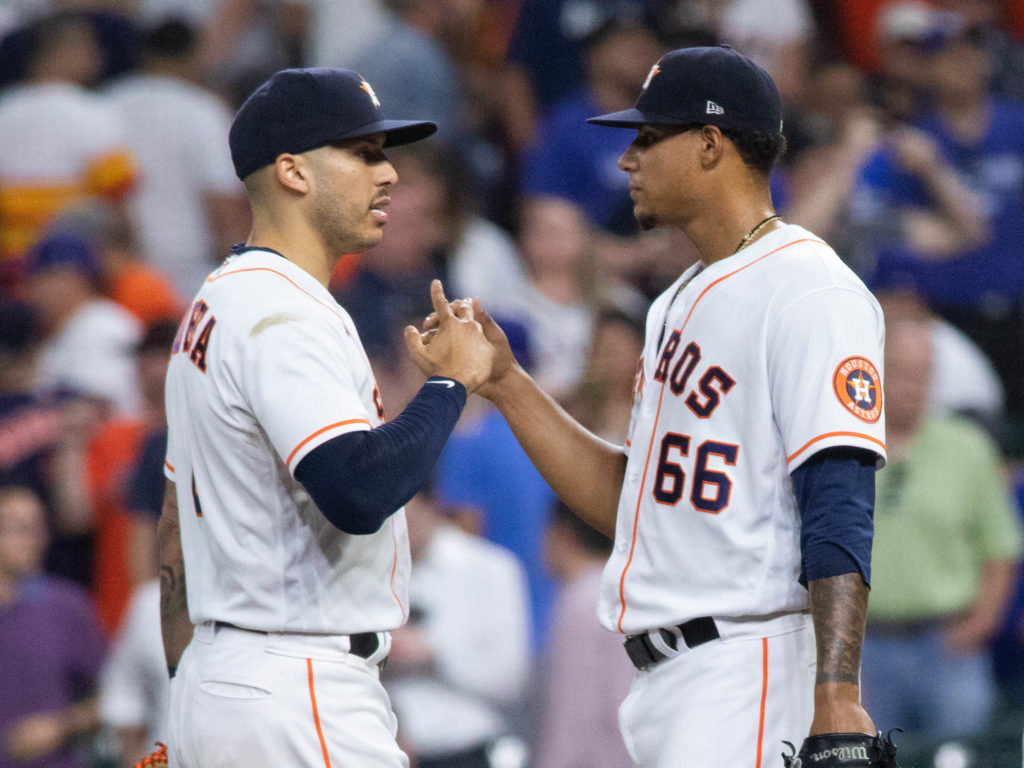 Bryan Abreu (No. 66) got the first save of his young career. But not until Carlos Correa calmed him down twice. (Photo by F. Carter Smith)