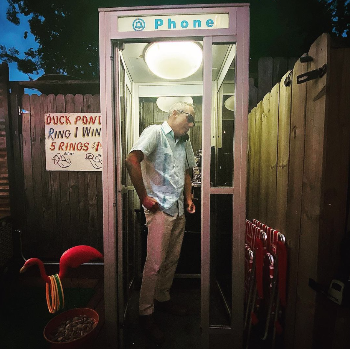 Mark Sullivan joins the kitschy fanfare in the old school telephone booth at Fat Boots Trailer Park Bar. (Instagram photo)