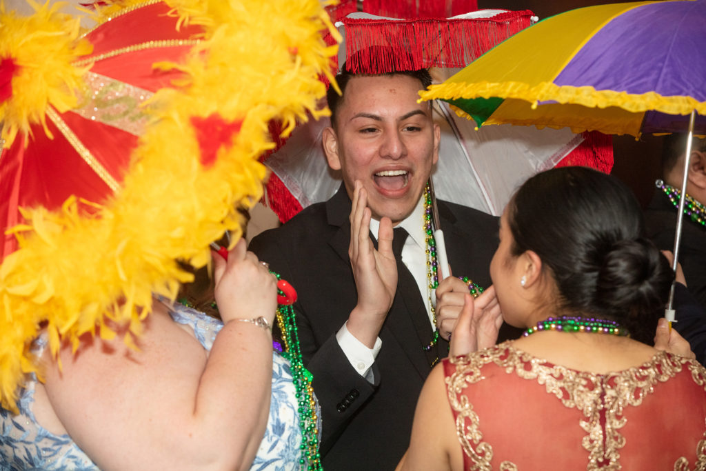Juan Bravo among the University of St. Thomas students celebrating at the annual Mardi Gras Ball.