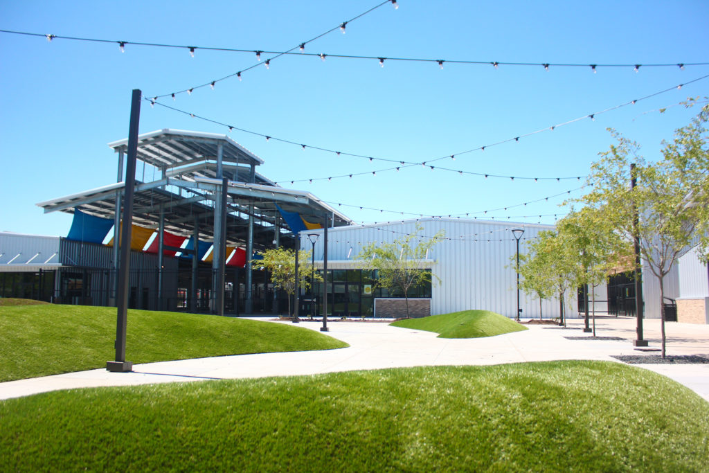 Houston Farmers Market includes a green space with two small hills.