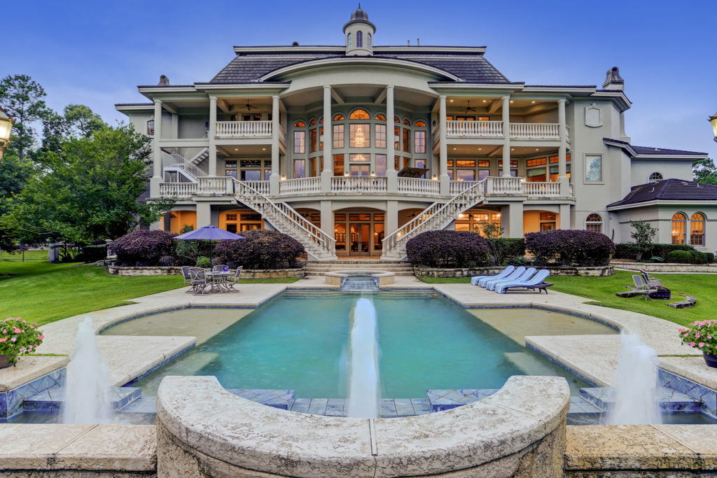 Three terraces offer views of the pool and the surrounding manicured acreage at 8 Deer Ridge Estates Boulevard. (Photo by TK Images)