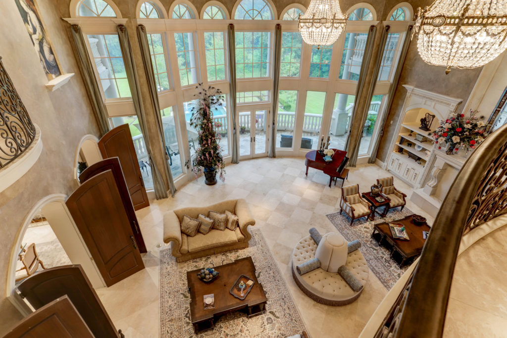 Arched doors lead from the living room into the kitchen speaking to the open floor plan of the main floor. (Photo by TK Images)
