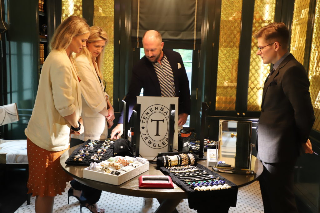 Tenenbaum Jewelers' Tony Bradfield is joined at the Fashion & Fine Art event. (Photo by Lilly Oren)
