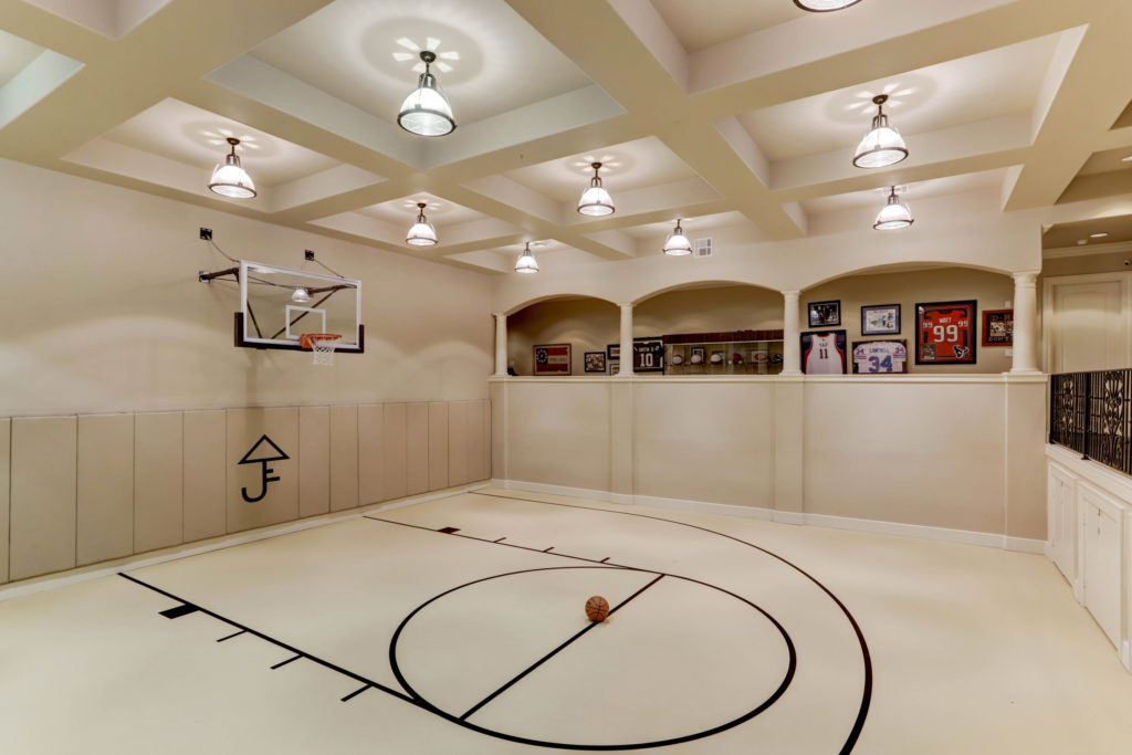 Another example of an indoor half basketball court in a Houston home. (Photo by TK Images)