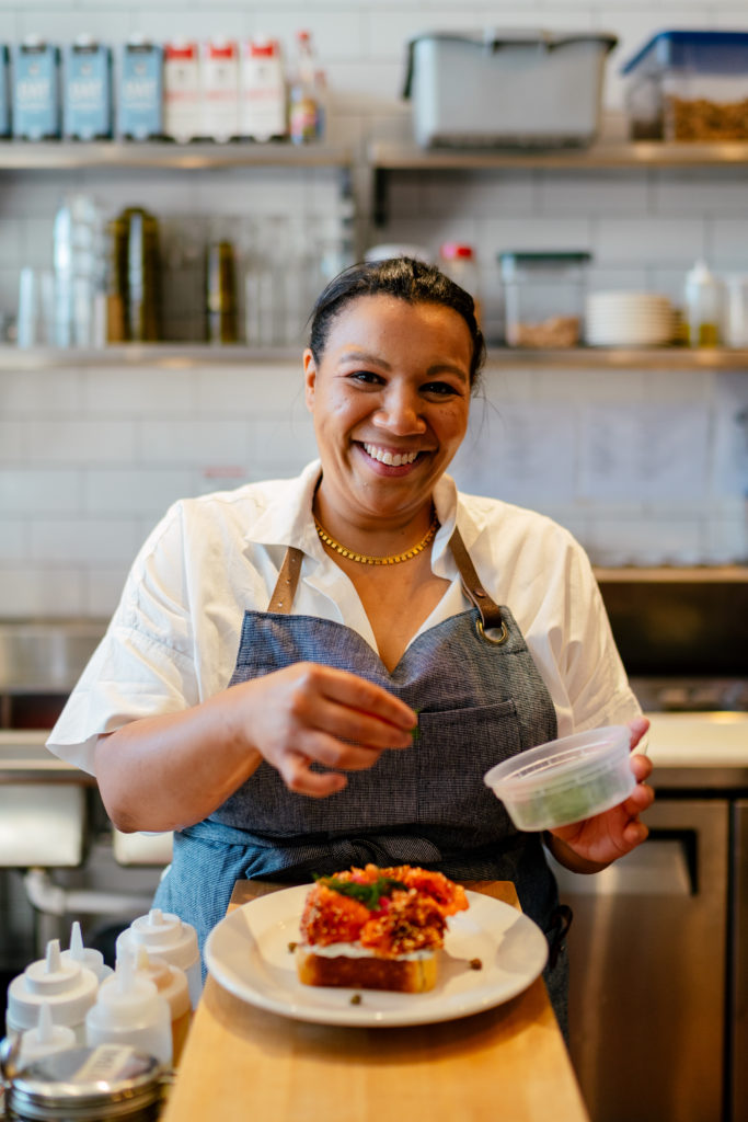 Kiki Louya, executive director of Detroit's Restaurant Workers Community Foundation, joins the Juneteenth dinner celebration (Photo by Nick Hagen for The New York Times)