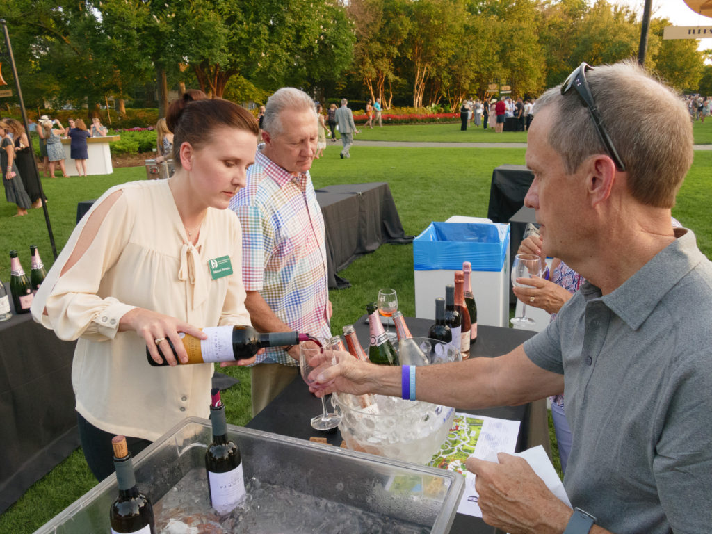 Megan Proska serves wine to a guest (Photo by Dallas Arboretum/Steve Foxall)