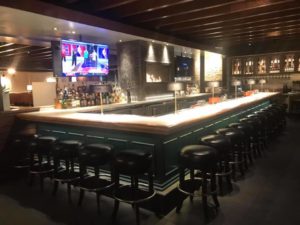 Towne Grill – Interior features an oversized L-shaped bar. Photo by 8.10 Construction Solutions LLC