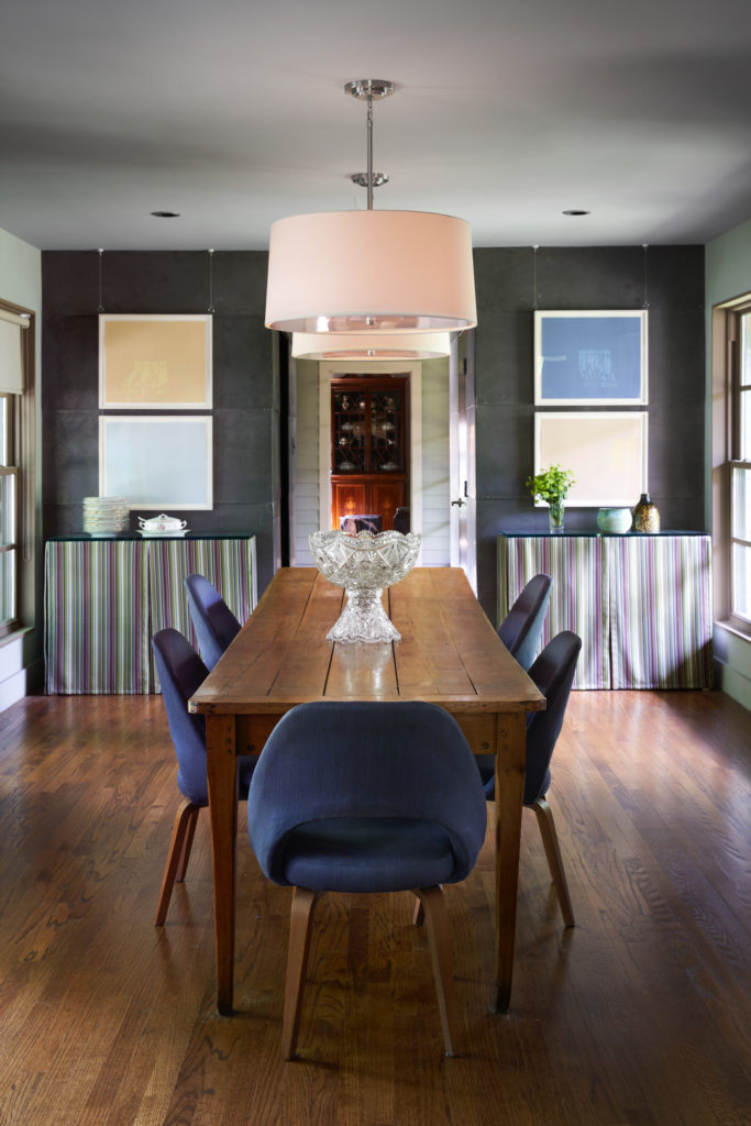 From the dining room, an enfilade of rooms is framed by doorways. The 350-year-old French table is from Goodchilds Inc. Vintage Saarinen chairs from Collage 20th Century Classics. Skirted consoles designed by Alice Cottrell. Artworks by New York City artist Mary Temple, purchased at the Dallas Art Fair. (Photo by Pär Bengtsson)