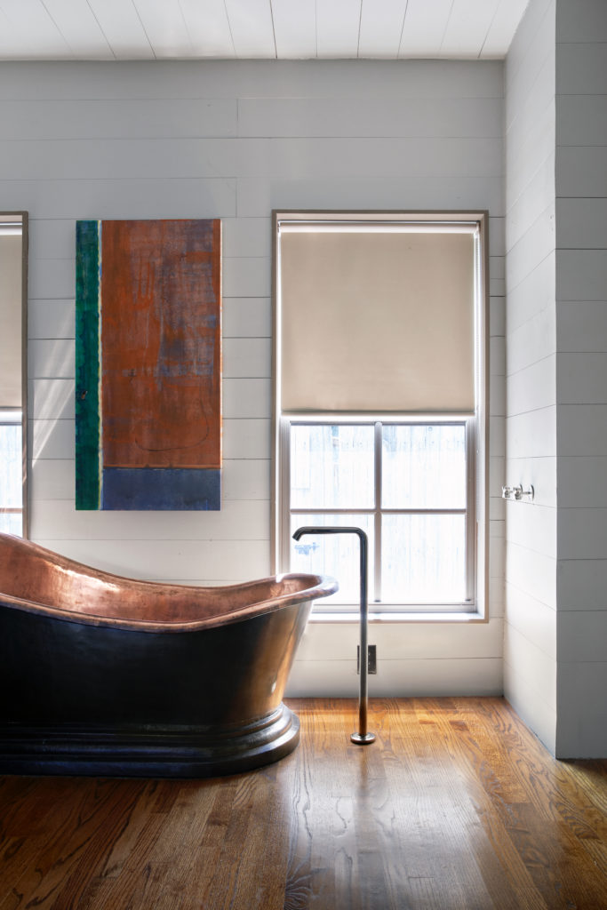 Copper tub from Big Mango Trading Co. Waterworks fixtures. The painting, created by Tibbs, depicts an earlier architecture project. (Photo by Pär Bengtsson)