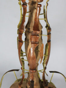 For “Skinned Table,” Joyce Lin used a razor blade to lift the veneer, which she mounted on  brass pegs.