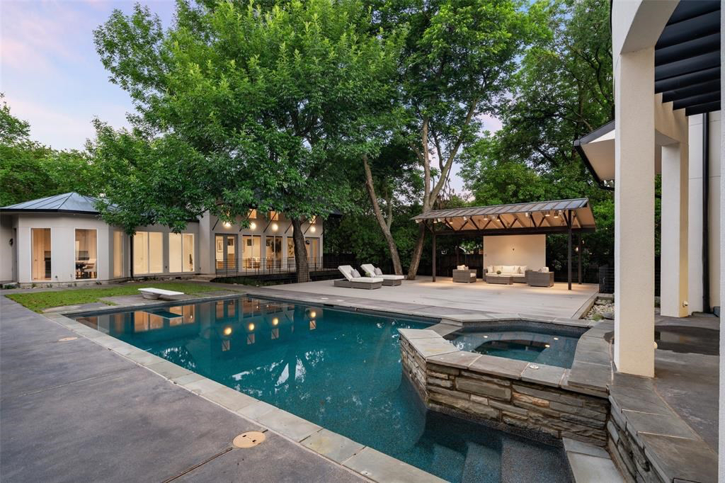 Dip into the hot tub for excellent backyard views. 