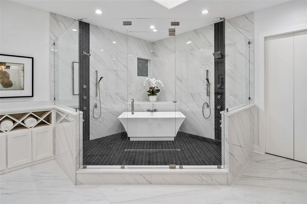 A striking, standalone tub is the focal point for the master bathroom. 