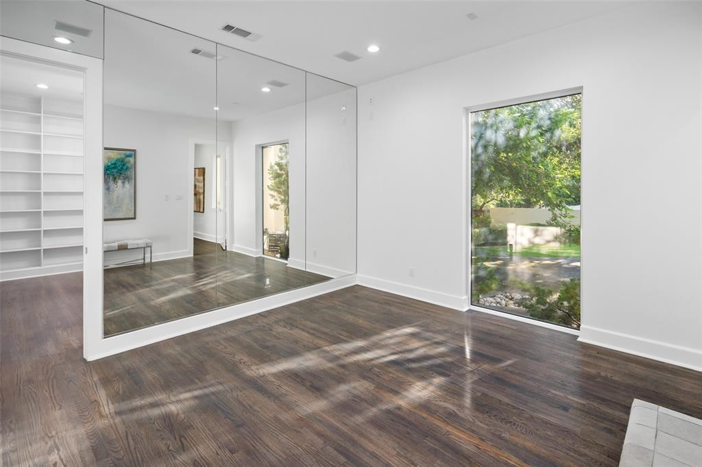 A spacious dressing room is attached to the walk-in closet. 