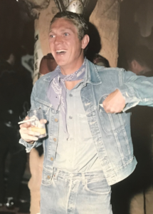 Style icon Steve McQueen rocking a bandana loosely knotted around his neck.