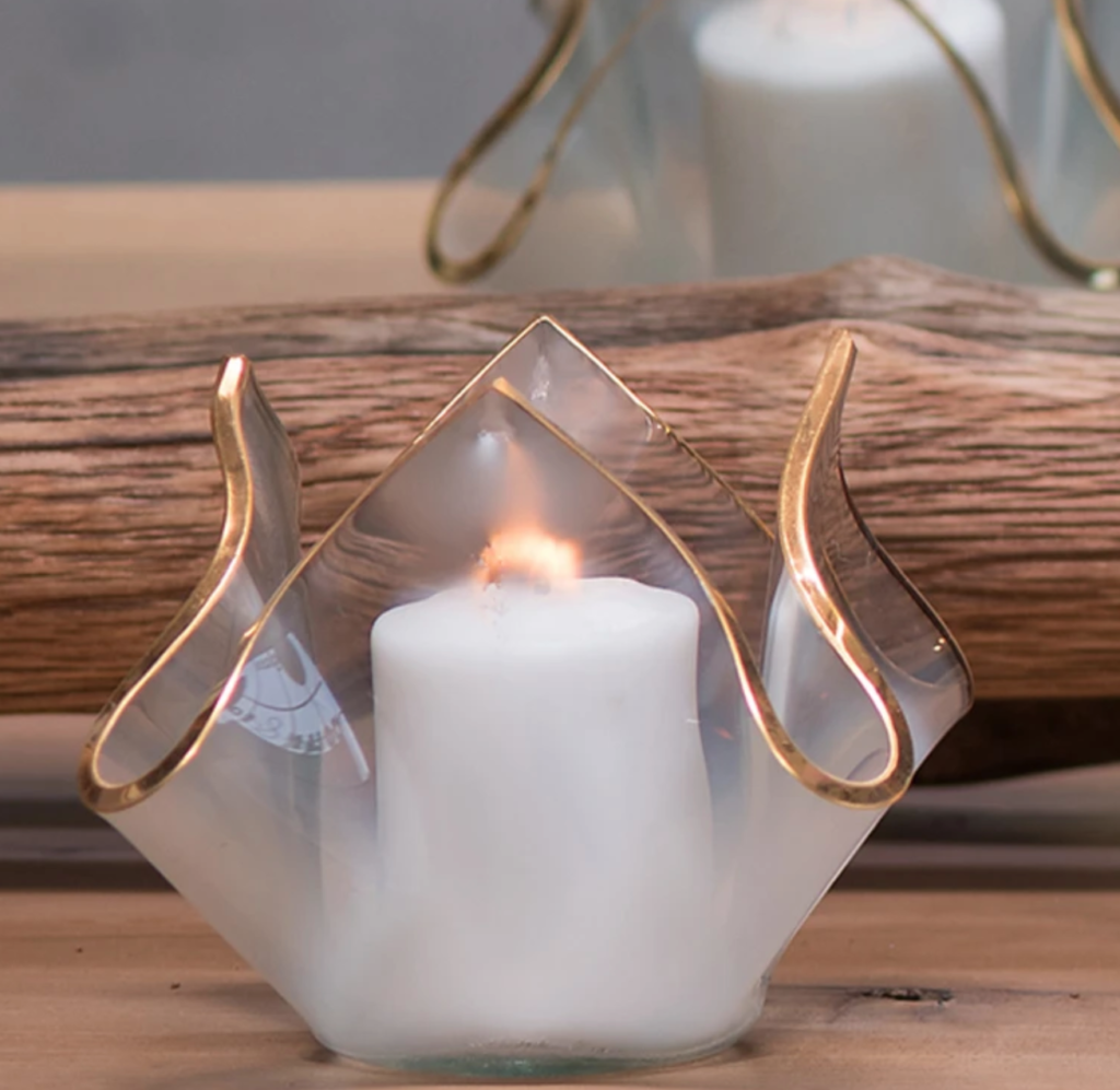 The Annieglass Handkerchief Votive gently sculpted votive candle holder takes the shape of a handkerchief.