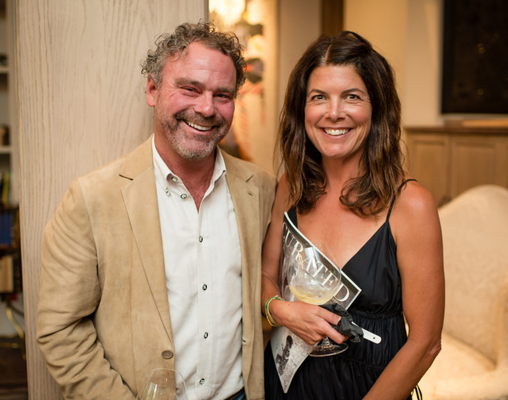 Michael Bradley, Karrie Sims, TAG Media founder, at the Exclusive Resorts event at the Aspen home of Glenn Bucksbaum (Photo by Ross Daniels Photography) 