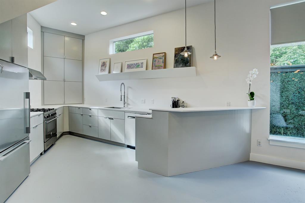 The footprint of the Triangle House in The Heights does little to impair the functionality of the kitchen.