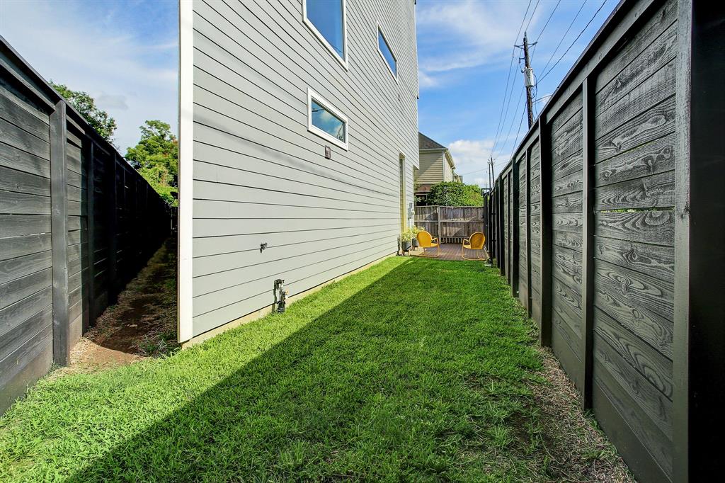 Green space on the back side of the Triangle House in The Heights.