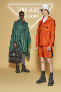 Left model: Prada nylon poncho, $1,610, pants price available upon request (not avail until October), sunglasses price available upon request, bag $1,590, shoes $1,170, Right model: Prada jacket $1,610, shorts $1,010, hat $595, shoes $1,170, most items available at the Prada Aspen boutique through September 7 (photo courtesy of Prada)