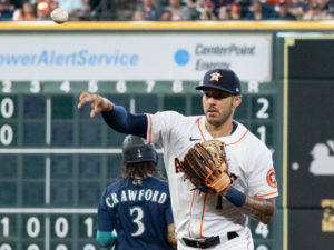Carlos Correa shows to first base. checks the defensive chart in his hat, The Astros beat the Seattle Mariners 15-1  at Minute Maid Park, Saturday August 21, 2021. Jake Odorizzi gothic the victory.